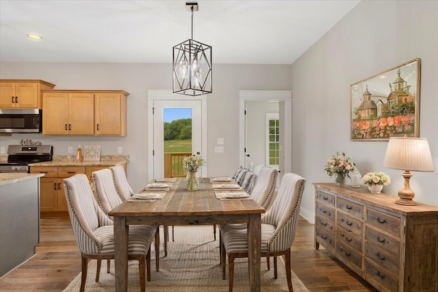 dining area with recessed lighting and dark wood-style flooring