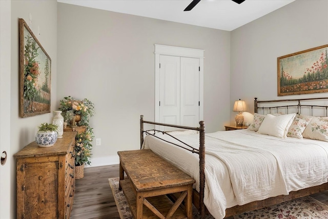 bedroom with ceiling fan, baseboards, and wood finished floors