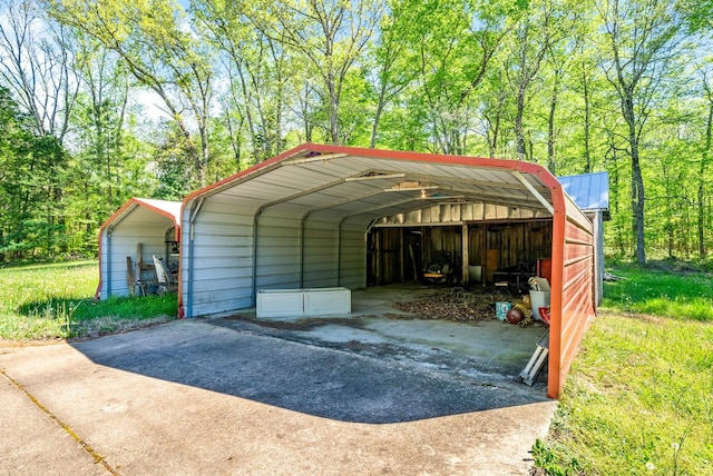 view of parking with concrete driveway and a carport
