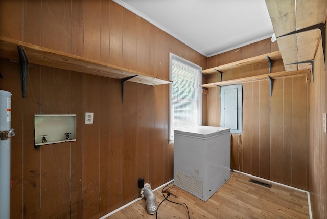 washroom featuring hookup for a washing machine, wood finished floors, wooden walls, laundry area, and visible vents