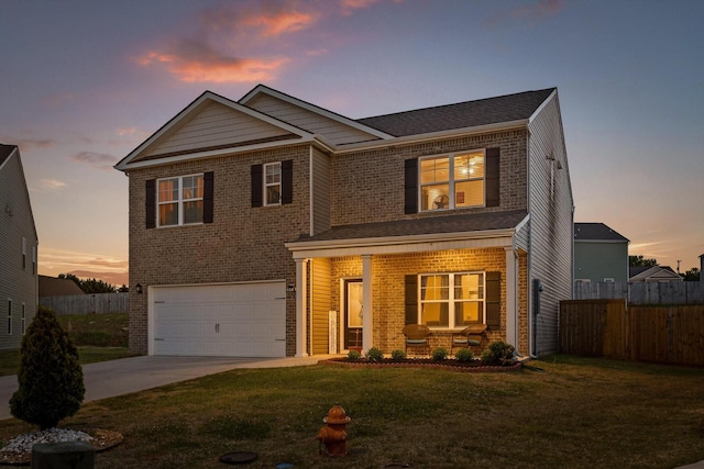 view of front facade with a front lawn, fence, a garage, and covered porch
