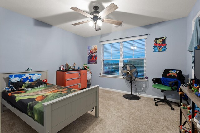 bedroom with baseboards, a ceiling fan, visible vents, and carpet