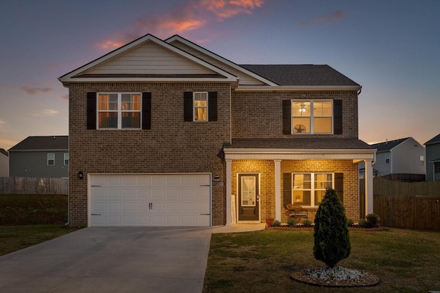traditional home featuring brick siding, fence, and driveway