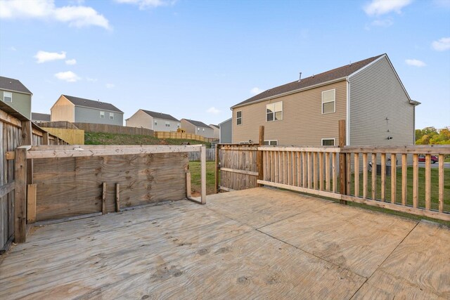 wooden deck with fence and a residential view