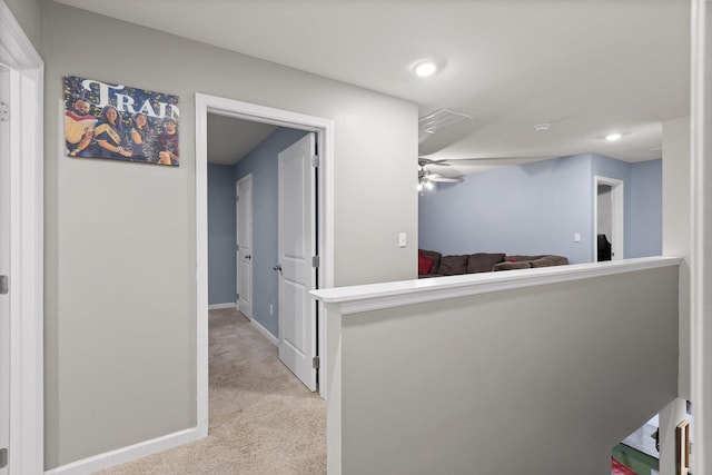hall with light colored carpet, baseboards, and recessed lighting