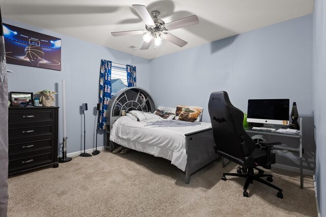 carpeted bedroom with ceiling fan, baseboards, and visible vents