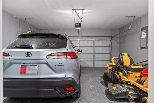 garage with electric panel and a garage door opener