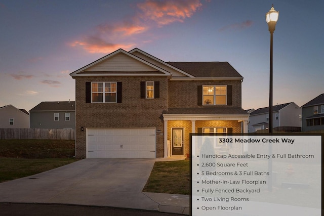3302 Meadow Creek Way, Cleveland, TN 37323 - view of front of home featuring brick siding, fence, and a garage