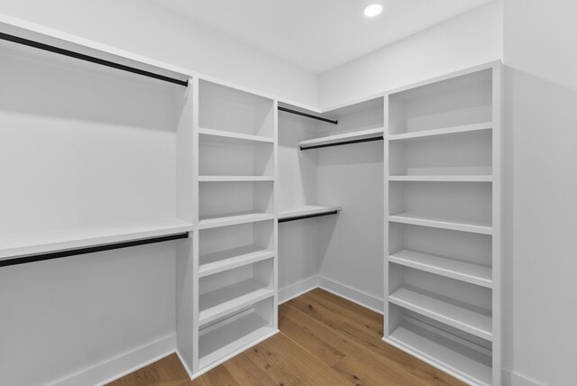 spacious closet with wood finished floors