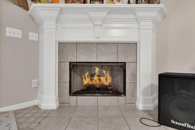 interior details with baseboards and a fireplace