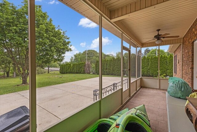 exterior space with ceiling fan