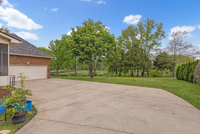 view of patio featuring concrete driveway