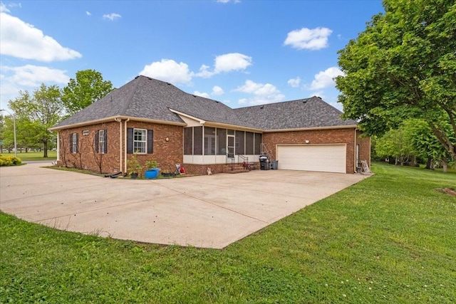 view of front facade with driveway, a garage, brick siding, and a sunroom