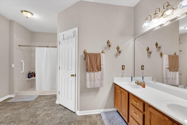 full bathroom featuring a shower with shower curtain, double vanity, a sink, and baseboards