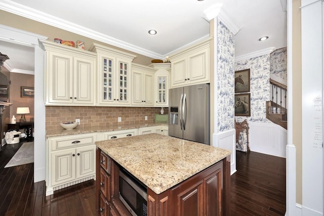 23475 Slate Rd, Athens, AL 35614 - kitchen featuring light stone countertops, dark wood-style flooring, cream cabinetry, and stainless steel appliances