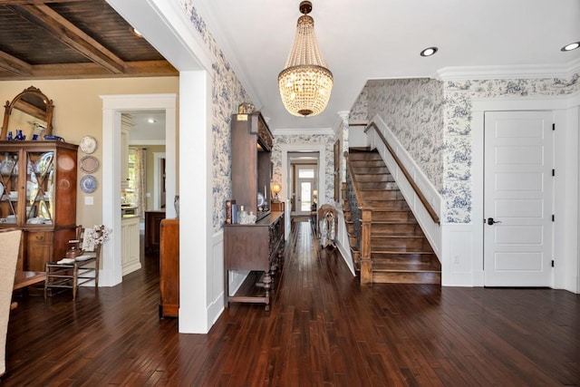 23475 Slate Rd, Athens, AL 35614 - entrance foyer with dark wood finished floors, wallpapered walls, crown molding, stairs, and a notable chandelier