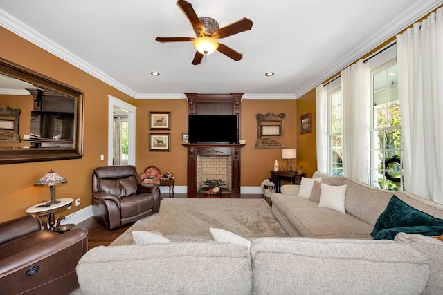 23475 Slate Rd, Athens, AL 35614 - living room with dark wood-style floors, baseboards, a ceiling fan, a large fireplace, and ornamental molding