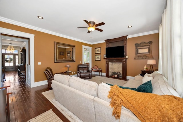 23475 Slate Rd, Athens, AL 35614 - living room with dark wood finished floors, baseboards, a brick fireplace, ceiling fan, and ornamental molding
