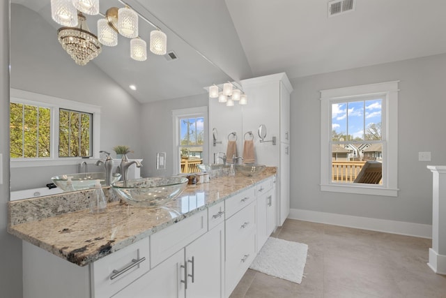 4306 Idaho Ave, Nashville, TN 37209 - bathroom featuring a sink, double vanity, lofted ceiling, a notable chandelier, and visible vents