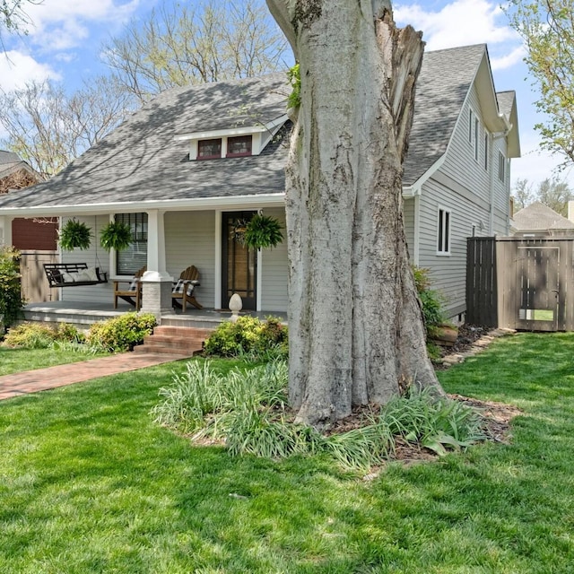 4306 Idaho Ave, Nashville, TN 37209 - view of front of property with covered porch, a front lawn, and roof with shingles