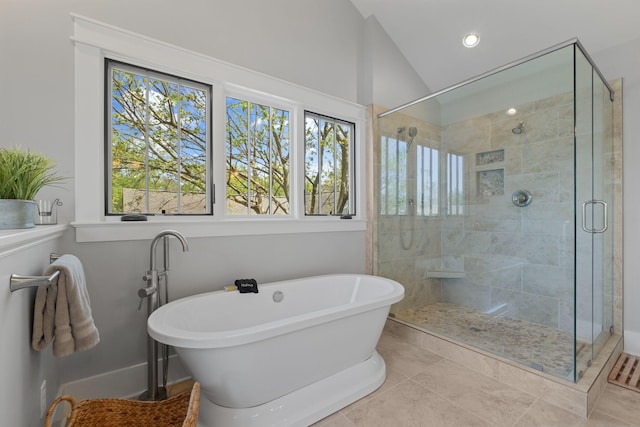 4306 Idaho Ave, Nashville, TN 37209 - bathroom with a stall shower, vaulted ceiling, a freestanding tub, and a healthy amount of sunlight