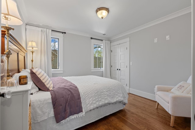4306 Idaho Ave, Nashville, TN 37209 - bedroom with multiple windows, wood finished floors, baseboards, and ornamental molding