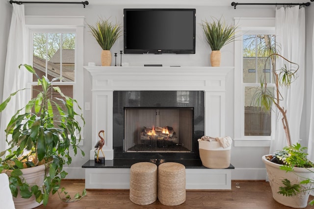 4306 Idaho Ave, Nashville, TN 37209 - interior details featuring wood finished floors, baseboards, and a lit fireplace