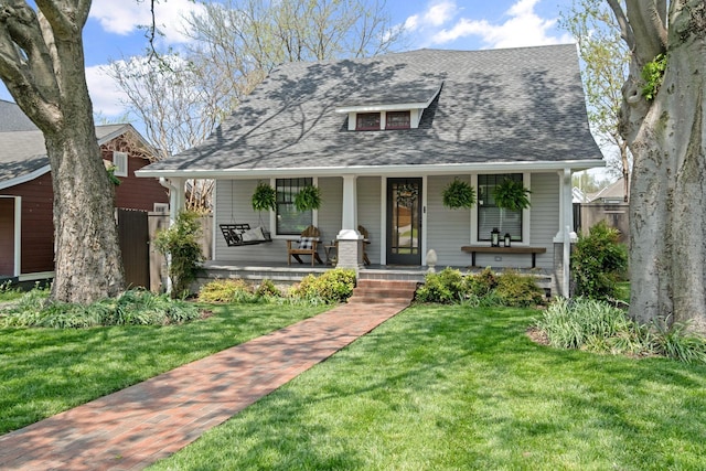 4306 Idaho Ave, Nashville, TN 37209 - bungalow-style house featuring a porch, a front yard, and a shingled roof