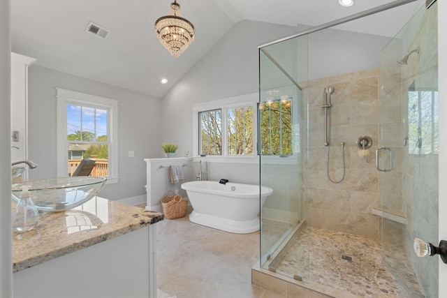 4306 Idaho Ave, Nashville, TN 37209 - full bathroom with visible vents, an inviting chandelier, a freestanding tub, a shower stall, and vanity
