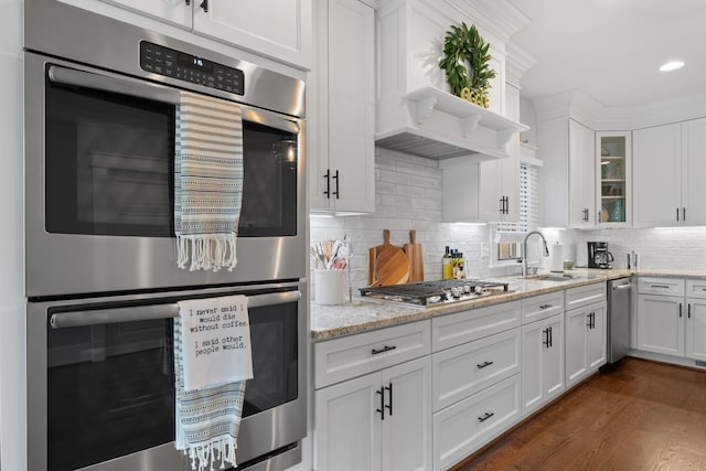 4306 Idaho Ave, Nashville, TN 37209 - kitchen with a sink, glass insert cabinets, stainless steel appliances, white cabinets, and light stone countertops