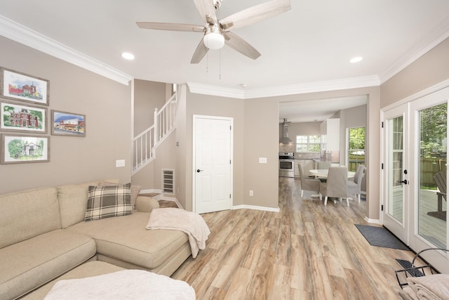 living area featuring light wood finished floors, ornamental molding, stairway, recessed lighting, and ceiling fan