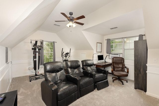 cinema with carpet flooring, a ceiling fan, lofted ceiling, healthy amount of natural light, and cooling unit