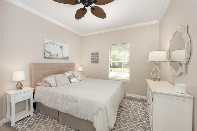 bedroom featuring crown molding, baseboards, and a ceiling fan
