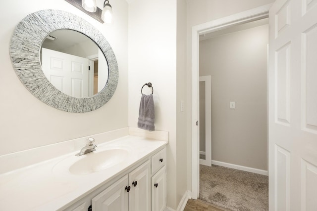 bathroom with vanity and baseboards