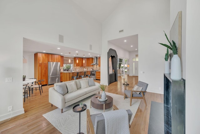 635 Harpeth Trace Dr, Nashville, TN 37221 - living area with light wood-style floors, recessed lighting, baseboards, and high vaulted ceiling