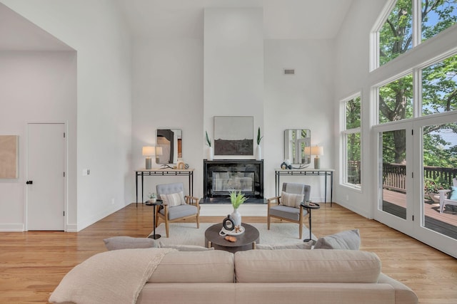 635 Harpeth Trace Dr, Nashville, TN 37221 - living area featuring wood finished floors, baseboards, a healthy amount of sunlight, and a towering ceiling