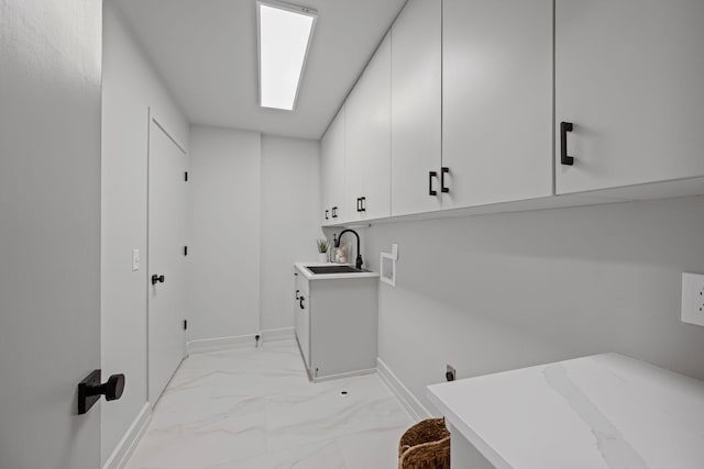 635 Harpeth Trace Dr, Nashville, TN 37221 - laundry room featuring washer hookup, cabinet space, a sink, baseboards, and marble finish floor