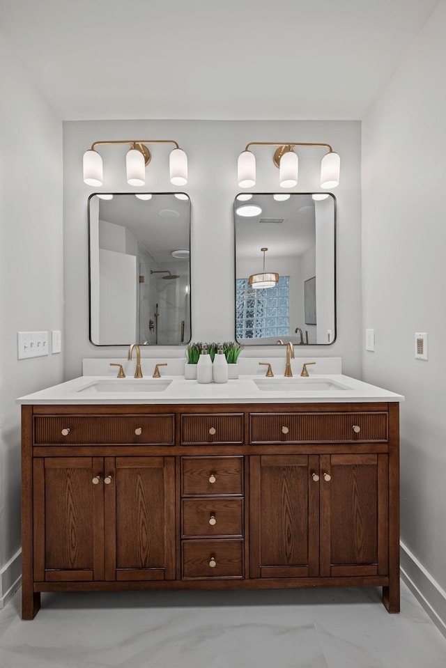 635 Harpeth Trace Dr, Nashville, TN 37221 - bathroom with double vanity, baseboards, and a sink