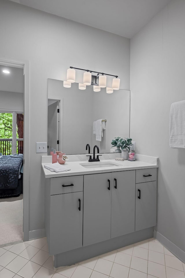 635 Harpeth Trace Dr, Nashville, TN 37221 - bathroom featuring vanity, tile patterned floors, baseboards, and ensuite bath