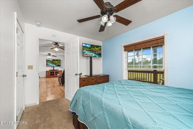 547 Clear Creek Ln, Monterey, TN 38574 - bedroom featuring ceiling fan, carpet flooring, access to exterior, and a textured ceiling