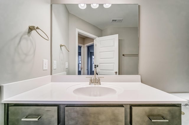 bathroom with visible vents and vanity