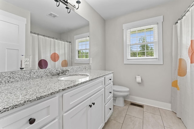 bathroom with toilet, tile patterned floors, visible vents, and vanity