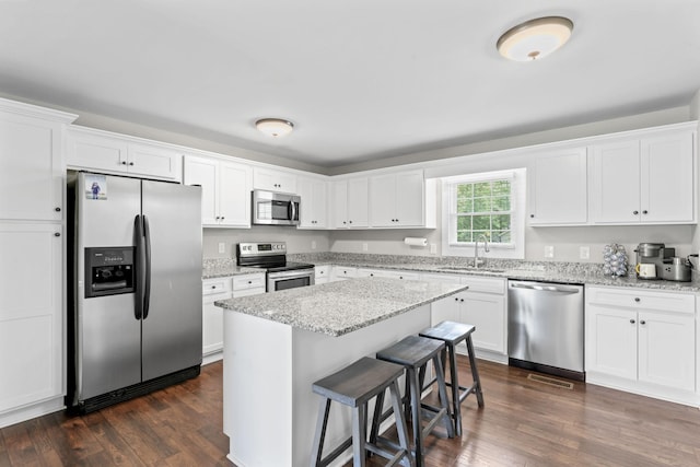 kitchen with white cabinets, stainless steel appliances, and a sink