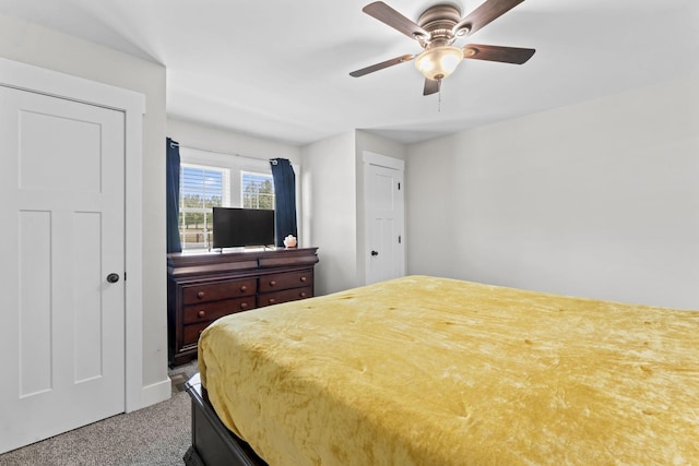 bedroom with baseboards, carpet, and a ceiling fan