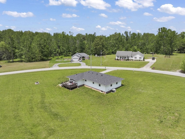 drone / aerial view featuring a view of trees