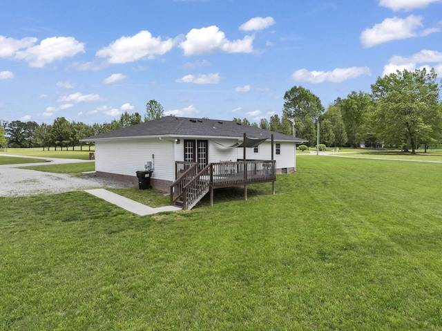 rear view of property with crawl space, a lawn, a wooden deck, a shingled roof, and stairs