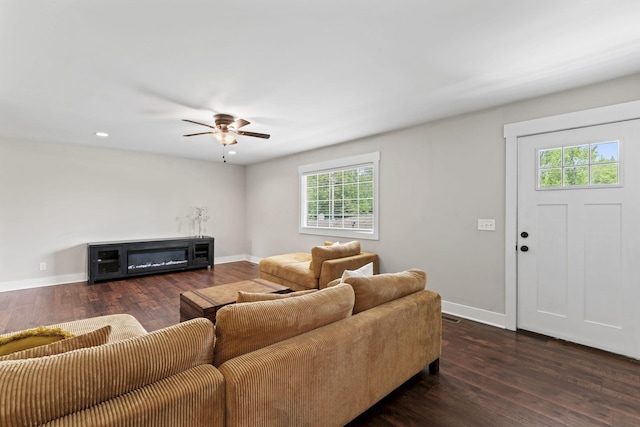 living room with wood-type flooring, recessed lighting, baseboards, and ceiling fan