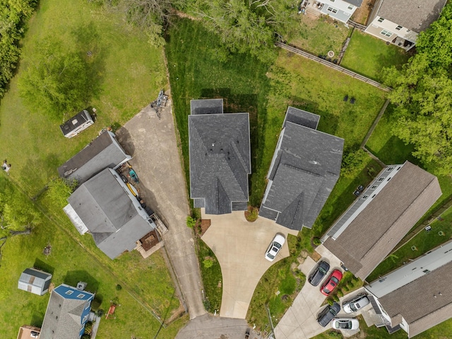 birds eye view of property with a residential view