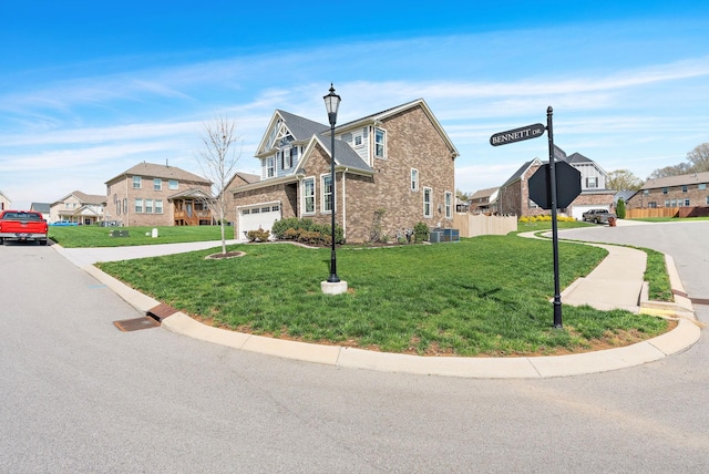 7025 Bennett Dr, Mount Juliet, TN 37122 - view of front facade with a residential view, central AC, a front yard, and concrete driveway