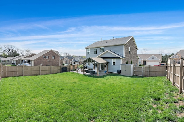 7025 Bennett Dr, Mount Juliet, TN 37122 - rear view of property featuring a residential view, a storage unit, a fenced backyard, a patio area, and a yard